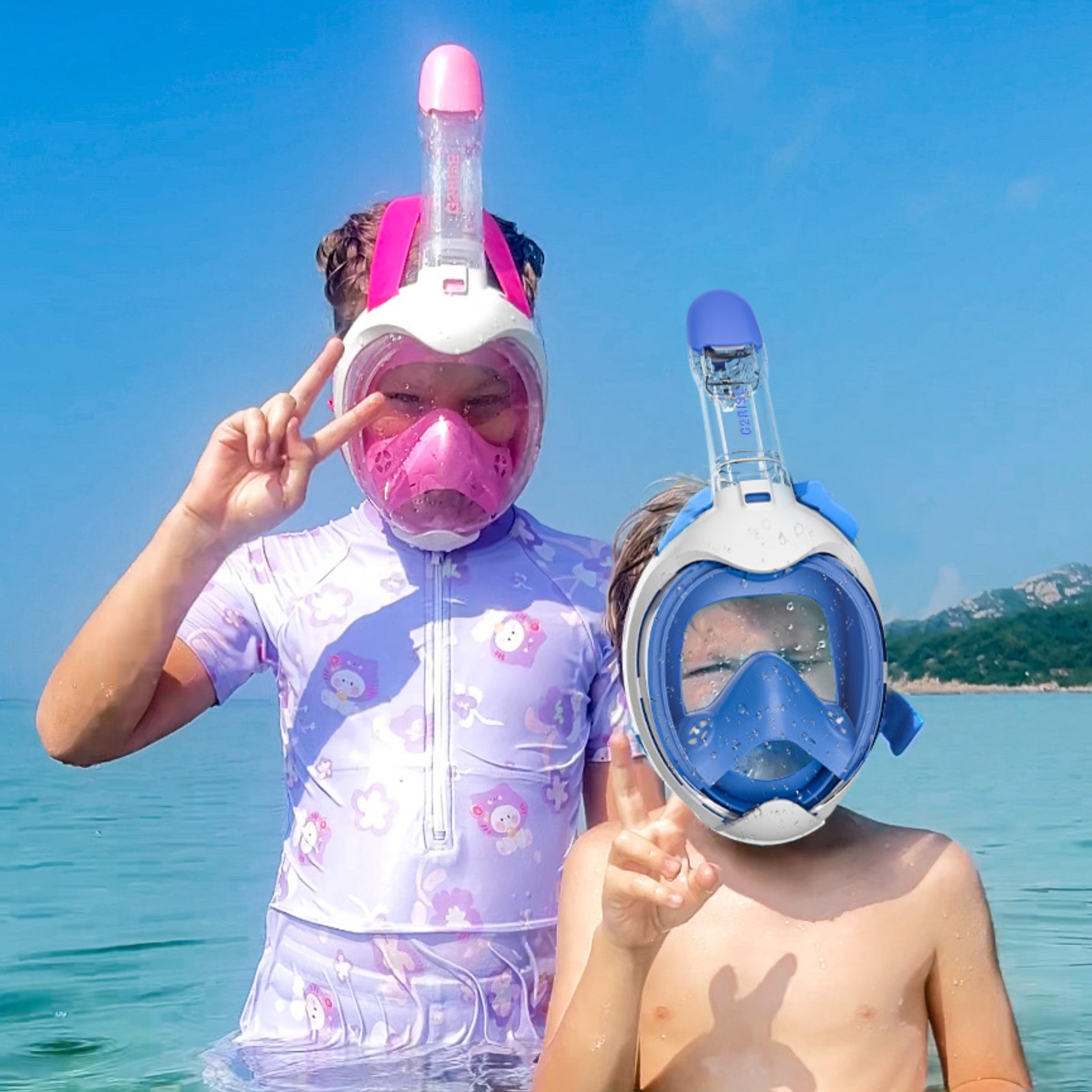 Children enjoying snorkeling with G2RISE masks in a bright, sunny environment.