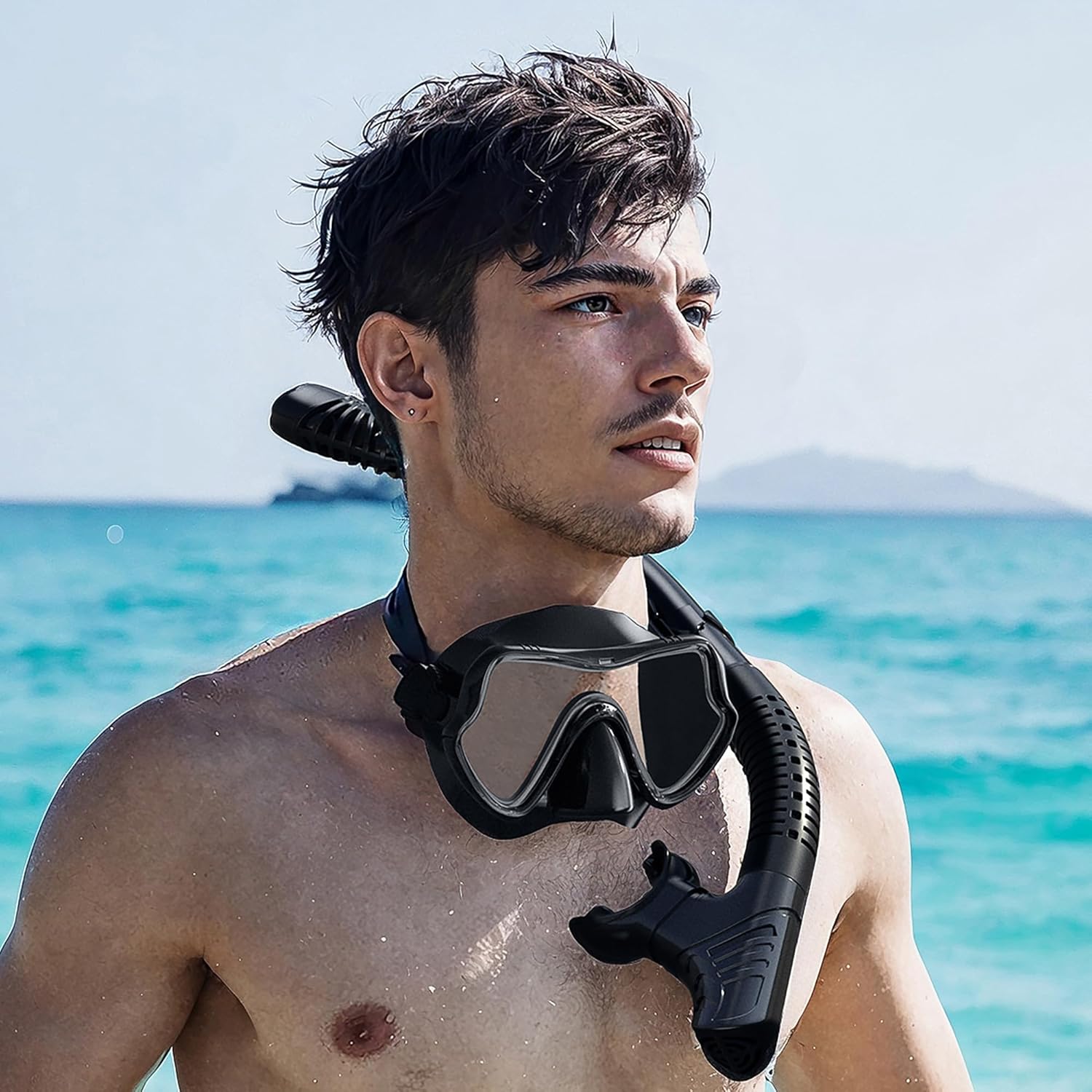Adult wearing black full face snorkel mask at the beach, showcasing snorkeling gear